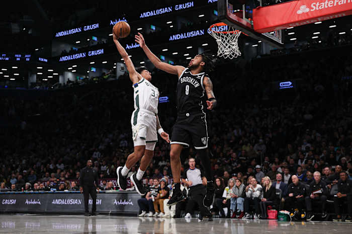 Milwaukee Bucks forward MarJon Beauchamp (3) goes up for a dunk against Brooklyn Nets forward Trendon Watford (9)
